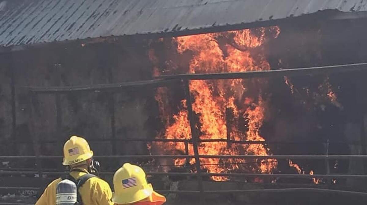 A barn fire burns on East Catlett Road in west Placer County on Wednesday, May 29, 2019. Cal Fire says the barn area contains about 300 tons of hay.