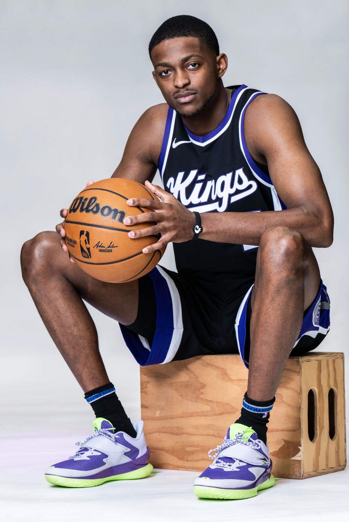 Sacramento Kings guard De’Aaron Fox wears his Fox 1 athletic shoe in ‘The Beam’ color scheme during media day on Sept. 30, 2024, at Golden 1 Center.