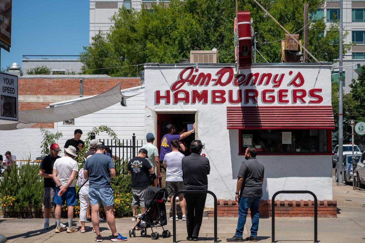 Customers line up shortly after opening at Jim-Denny’s in Sacramento on Wednesday, July 2, 2025.