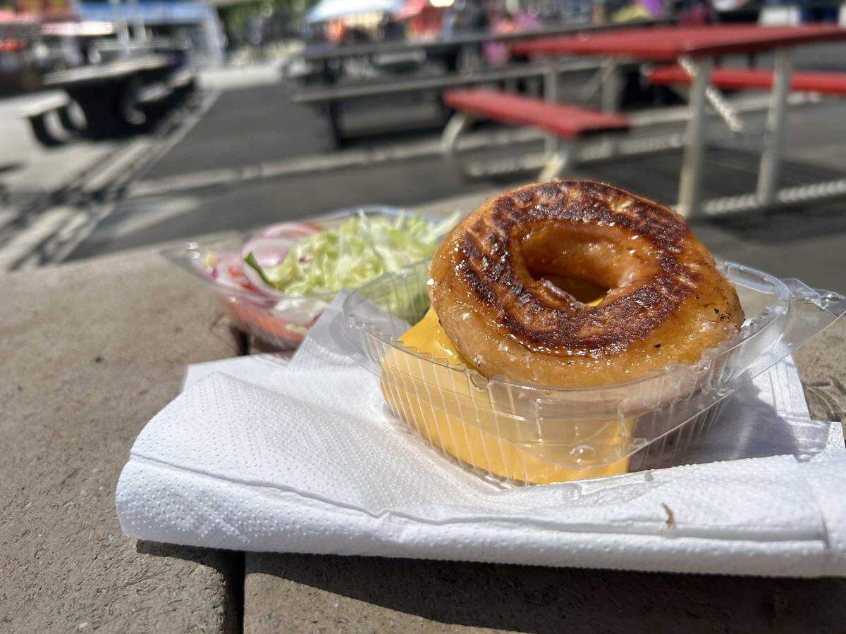 The Krispy Kreme sandwich, served at Boss Burger at the California State Fair, is a sweet and savory treat, where grilled glazed doughnuts replace the buns of an otherwise traditional cheeseburger.