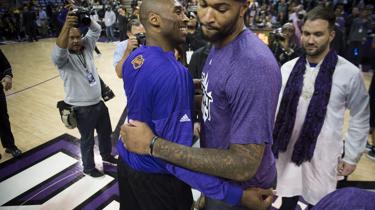 Los Angeles Lakers forward Kobe Bryant (24) hugs Sacramento Kings forward DeMarcus Cousins (15) before their game on Thursday, Jan. 7, 2016 at Sleep Train Arena in Sacramento.