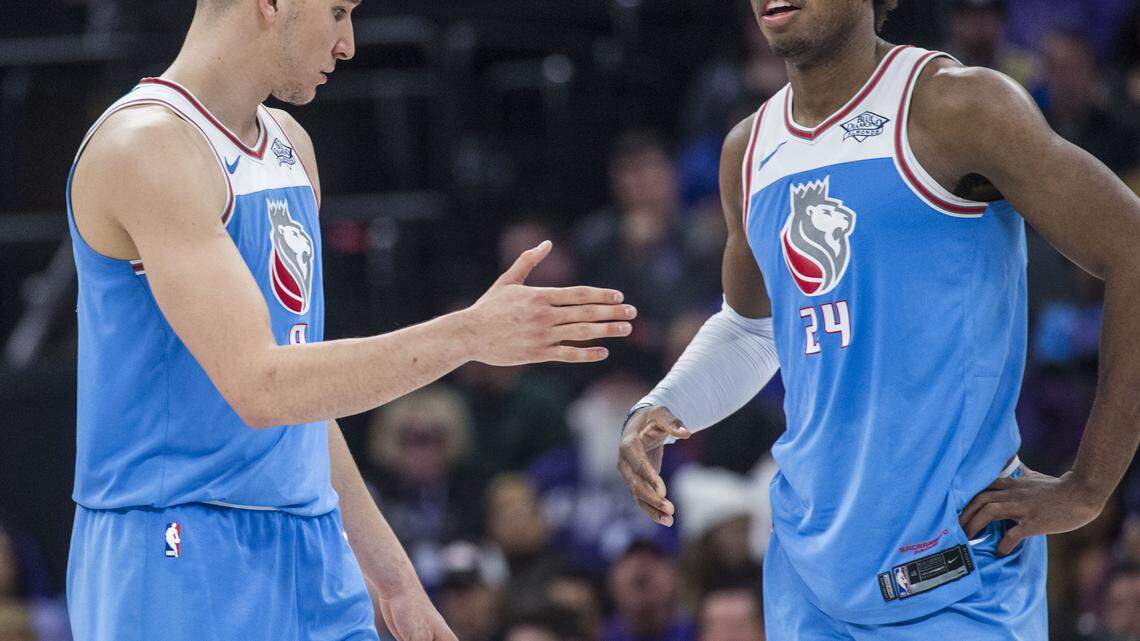 Sacramento Kings guard Bogdan Bogdanovic (8) shakes hands with teammate Buddy Hield (24) during their game against the Minnesota Timberwolves at Golden 1 Center in Sacramento, Calif. on Monday, Feb. 26, 2018.