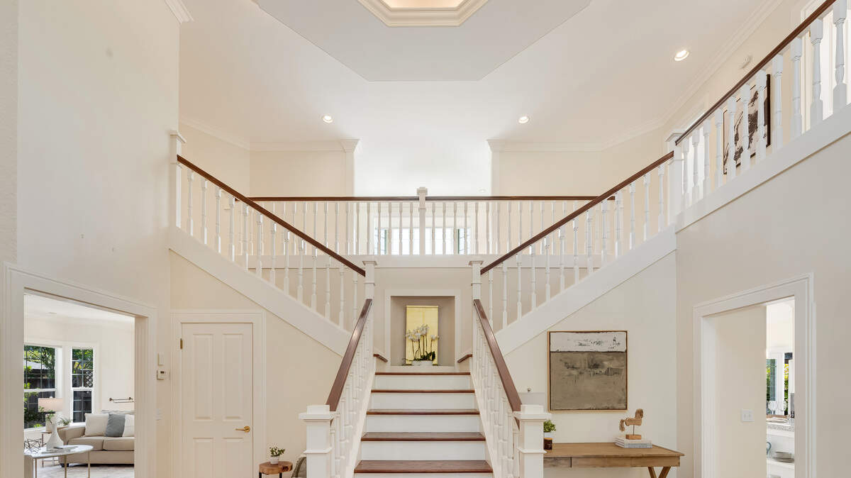 A split staircase in the Sonoma, California, home, off the entryway, leads your eyes upward.