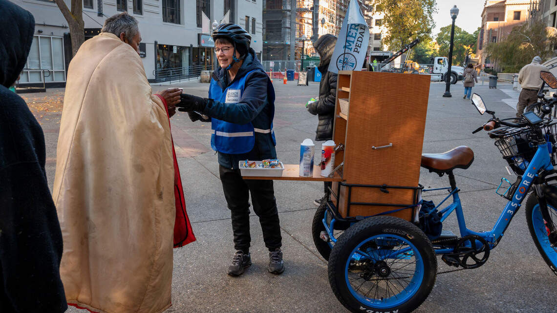 Book of Dreams: Volunteers put mettle to the pedal to assist Sacramento’s unhoused community
