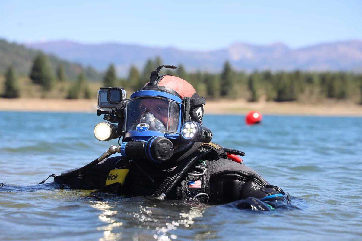 Nick Rinn of Adventure with Purpose works in the water to find Kiely Rodni’s vehicle, which was located submerged in Prosser Creek Reservoir on Sunday, Aug. 21, 2022 near Truckee, Calif. The Oregon-based diving team located the SUV and a body believed to be that of missing teen Kiely Rodni.