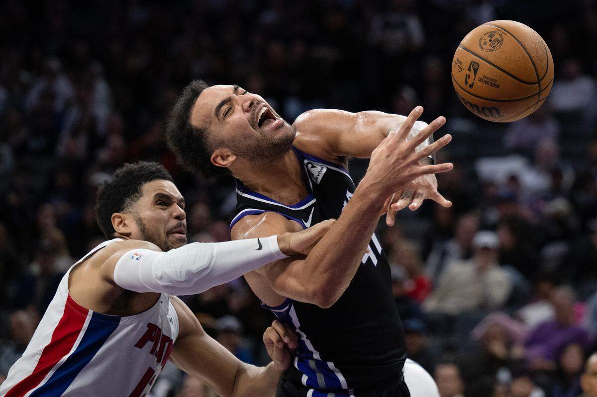 Sacramento Kings forward Trey Lyles (41) is fouled bay Detroit Pistons forward Tobias Harris (12) as he drives to the basket in the first half on Thursday, Dec. 26, 2024 at Golden 1 Center.