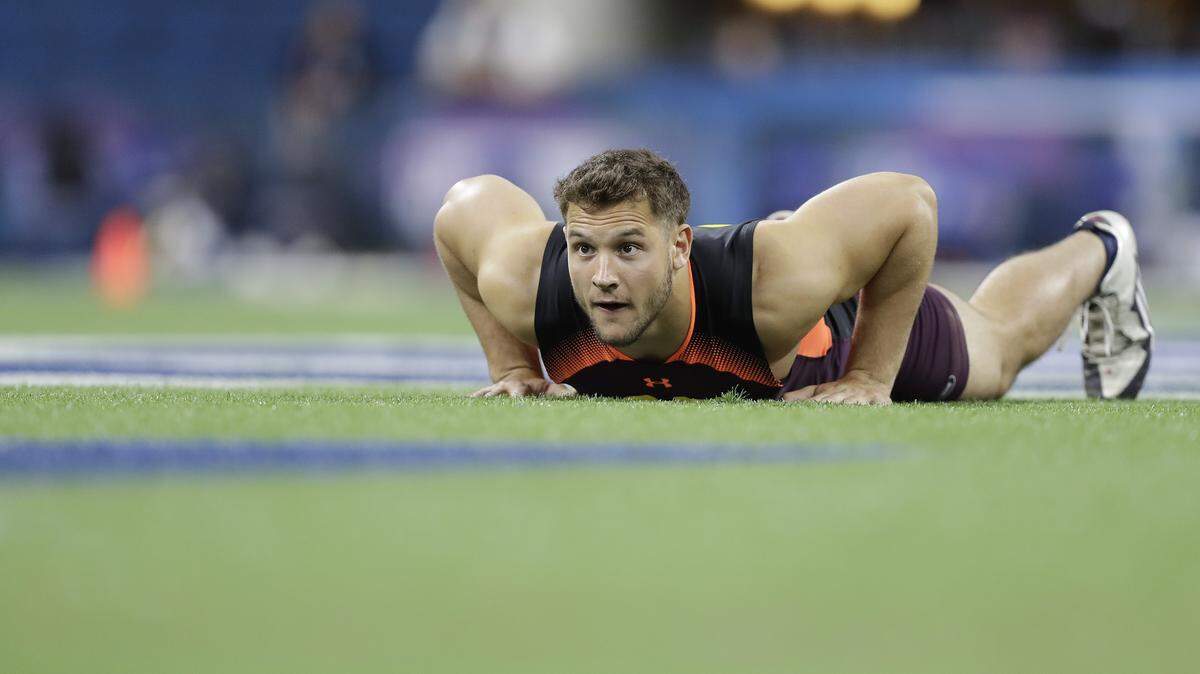 Ohio State defensive lineman Nick Bosa runs a drill during the NFL scouting combine March 3 in Indianapolis. He’s favored by national draft analysts to be taken No. 2 overall by the 49ers.