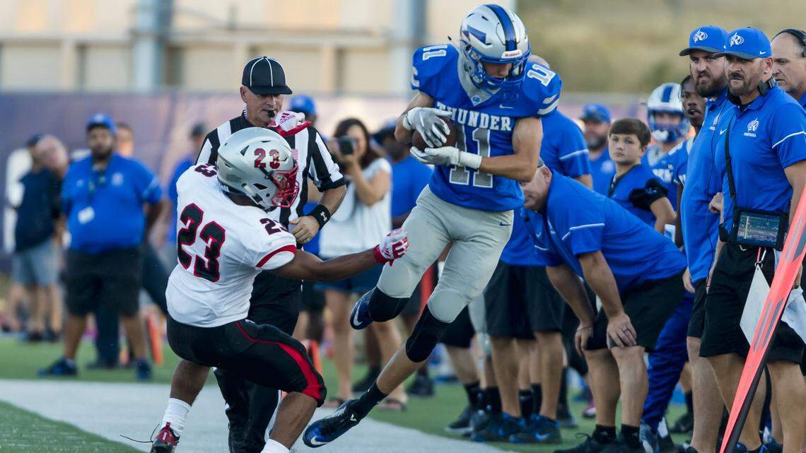 Antelope’s Brian Talley (23) pushes out Rocklin’s Liam Mays after his reception Aug. 17, 2018.