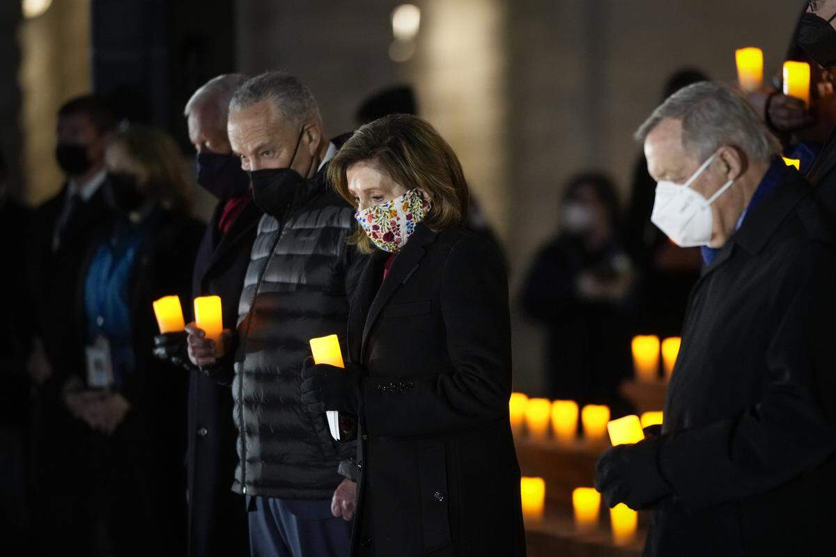 Senate Majority  Leader Chuck Schumer and Speaker of the House Nancy Pelosi participate in a prayer vigil at the U.S. Capitol on Jan. 6, 2022 in Washington, D.C., one year after supporters of President Donald Trump attacked the U.S. Capitol Building in an attempt to disrupt the confirmation of the electoral college win for Joe Biden.