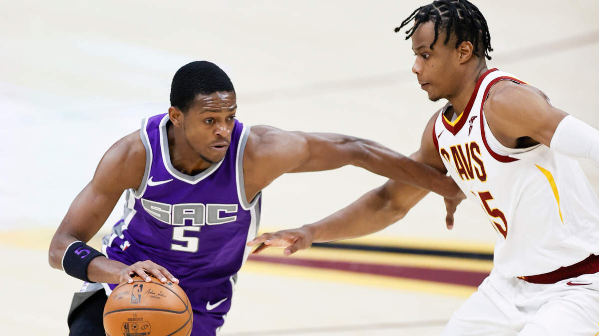 Sacramento Kings’ De’Aaron Fox (5) drives on Cleveland Cavaliers’ Isaac Okor (35) in the second half of an NBA basketball game, Monday, March 22, 2021, in Cleveland. The Kings defeated the Cavaliers 119-105. (AP Photo/Ron Schwane)