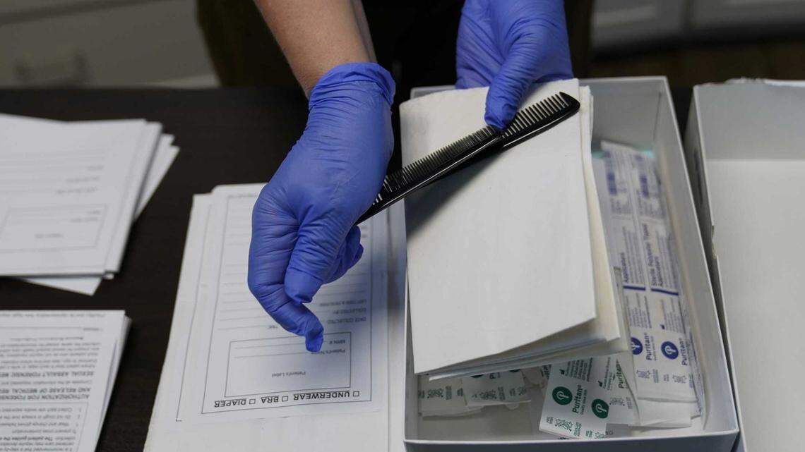 A sexual assault evidence collection kit, or rape kit, is unpacked in an examination room in Austin, Texas, in 2022. A new city audit says Sacramento police possess more than 300 rape kits that have not been tested since being collected before 2016.