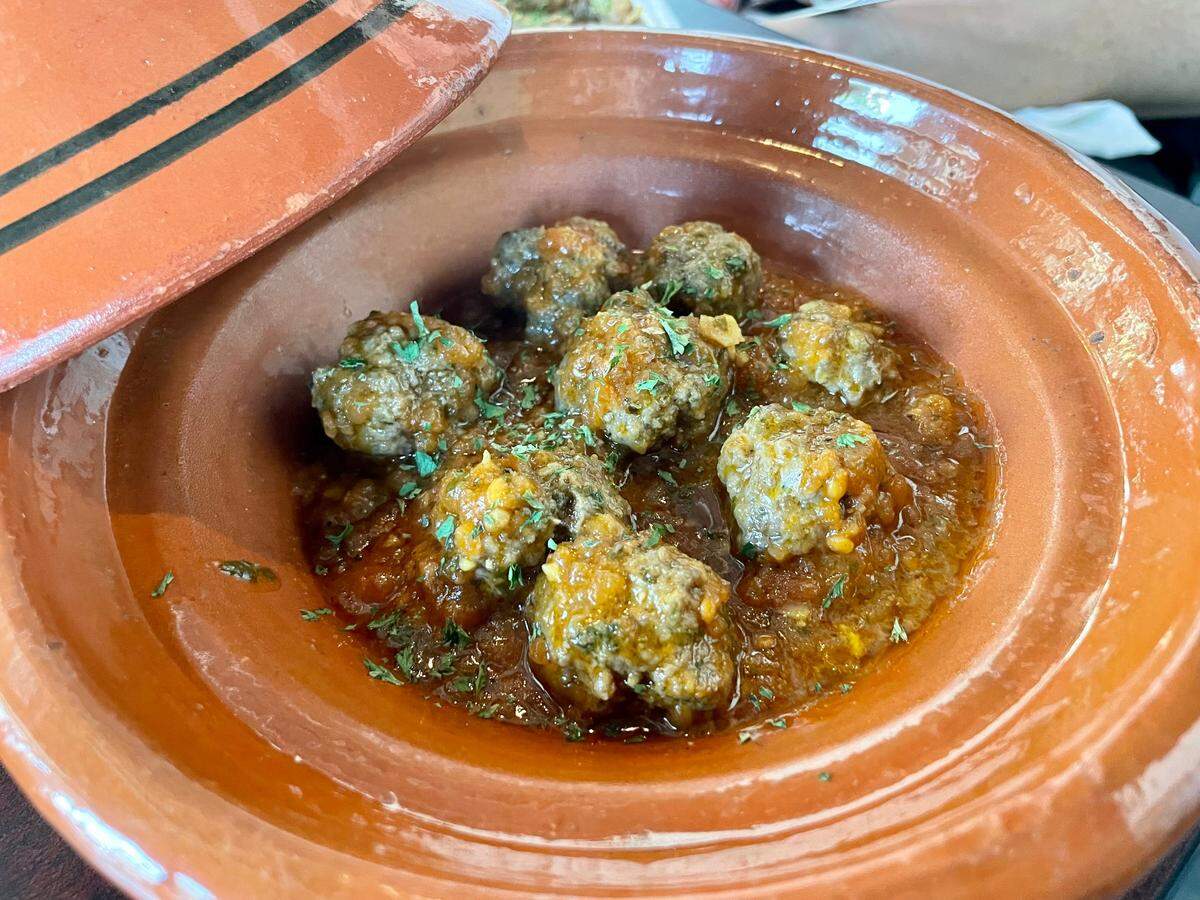 Kefta Tagine ($16.95), meat balls cooked in tomato sauce served with bread or rice at Little Morocco Cafe, 716 Seventh St.