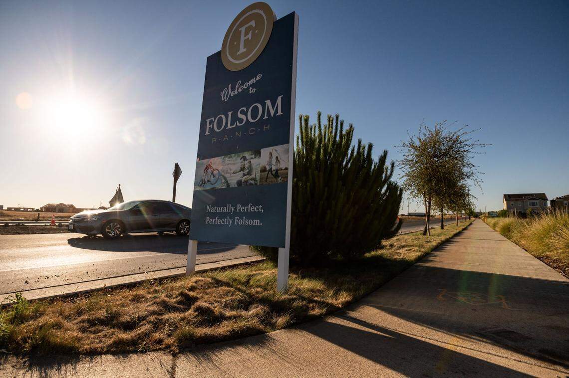 A sign advertising for the Folsom Ranch development greets drivers on East Bidwell Street, south of Highway 50, in July. Construction is underway in subdivisions west of East Bidwell, while many homes to the east are completed and now occupied.