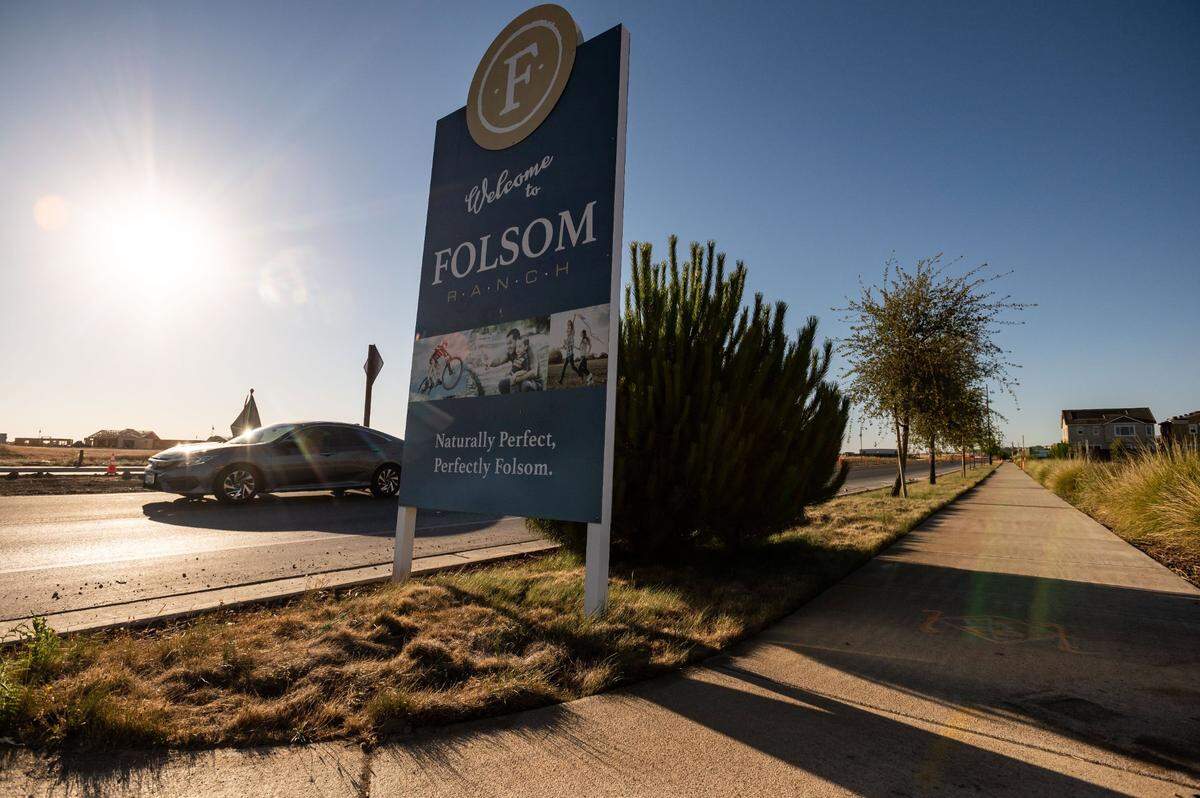 A sign advertising for the Folsom Ranch development greets drivers on East Bidwell Street, south of Highway 50, in July. Construction is underway in subdivisions west of East Bidwell, while many homes to the east are completed and now occupied.