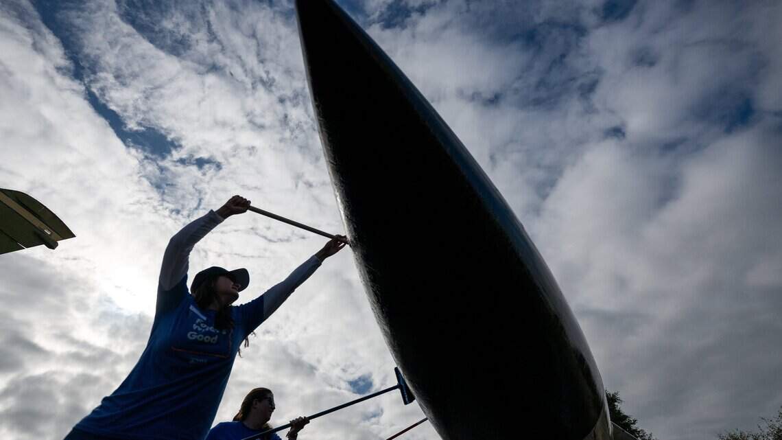 Week in photos: Plane wash + 9/11 + new supermarket + rodeo