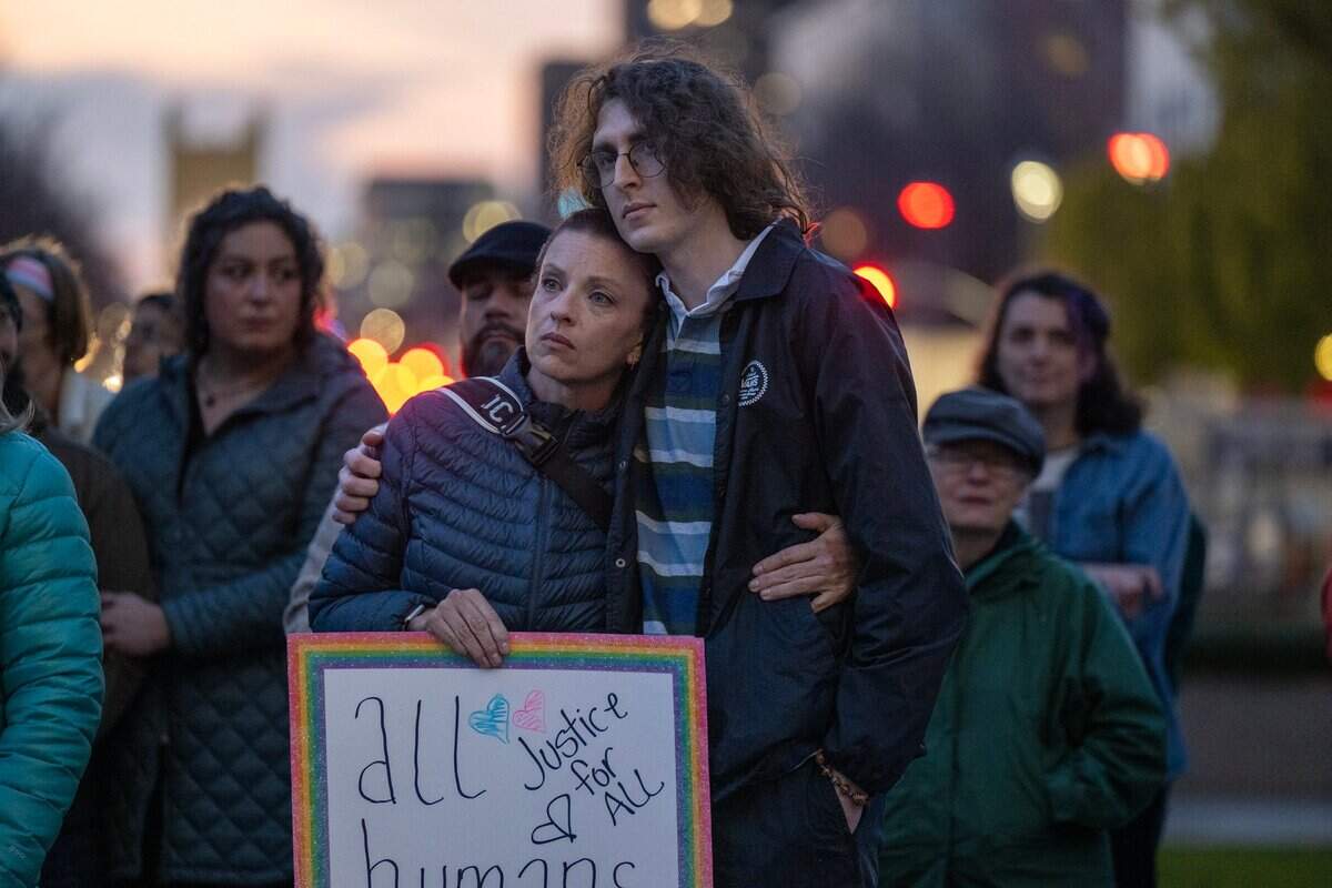 Charise Spencer and Alex Spencer of Loomis embrace each other as they listen to speakers at the transgender unity rally at the state Capitol on Thursday.