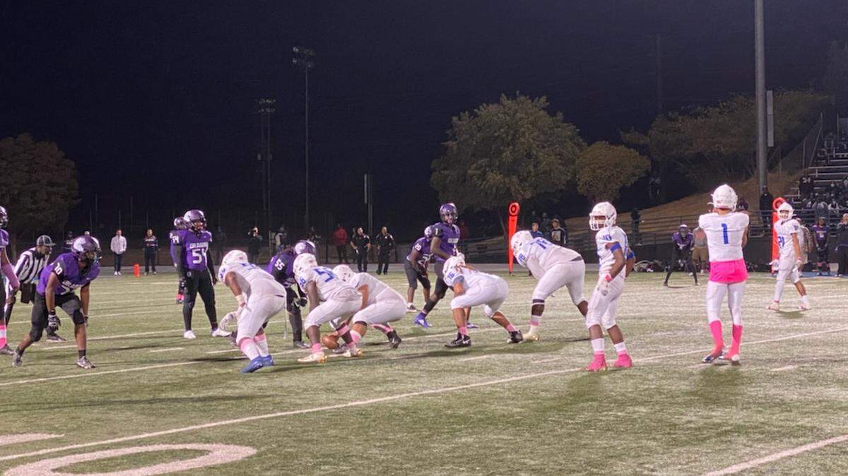 Quarterback Anthony Garcia looks to the Capital Christian sideline during a game against Sacramento on Friday night.