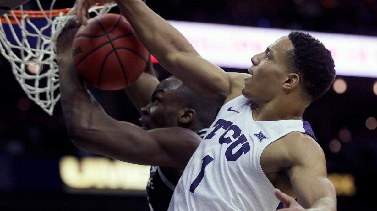 TCU guard Desmond Bane blocks a shot by Kansas State forward Makol Mawien, left, on March 11 in the Big 12 tournament. Bane was selected by the Memphis Grizzlies in the first round of Wednesday’s NBA Draft.