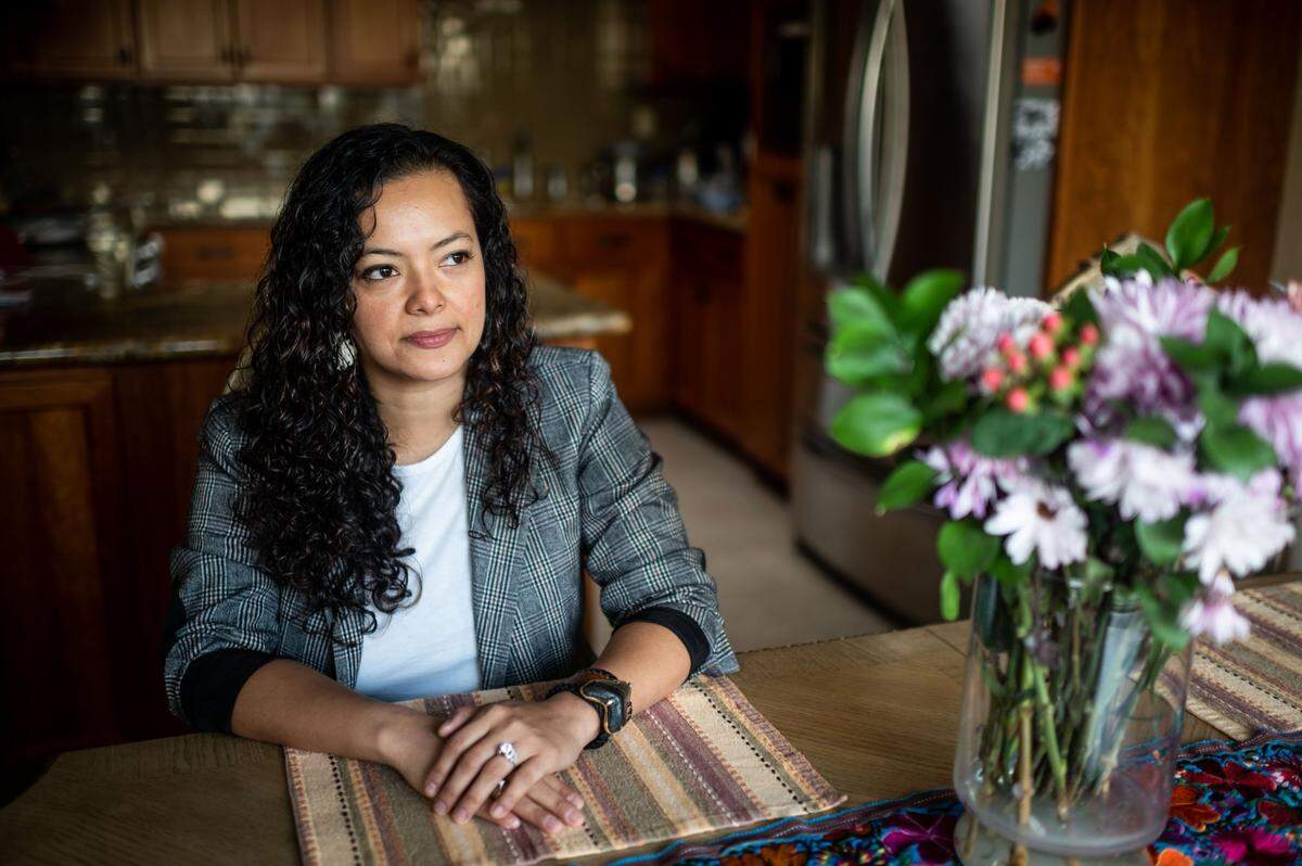 Orangevale resident Laiza Negrete, who helped her in-laws file for unemployment benefits over the phone during the coronavirus pandemic, sits at her kitchen table Wednesday, March 3, 2021. A recent study found that eligible California Latino workers are less likely to receive unemployment benefits due to a lack of computer proficiency or internet issues.