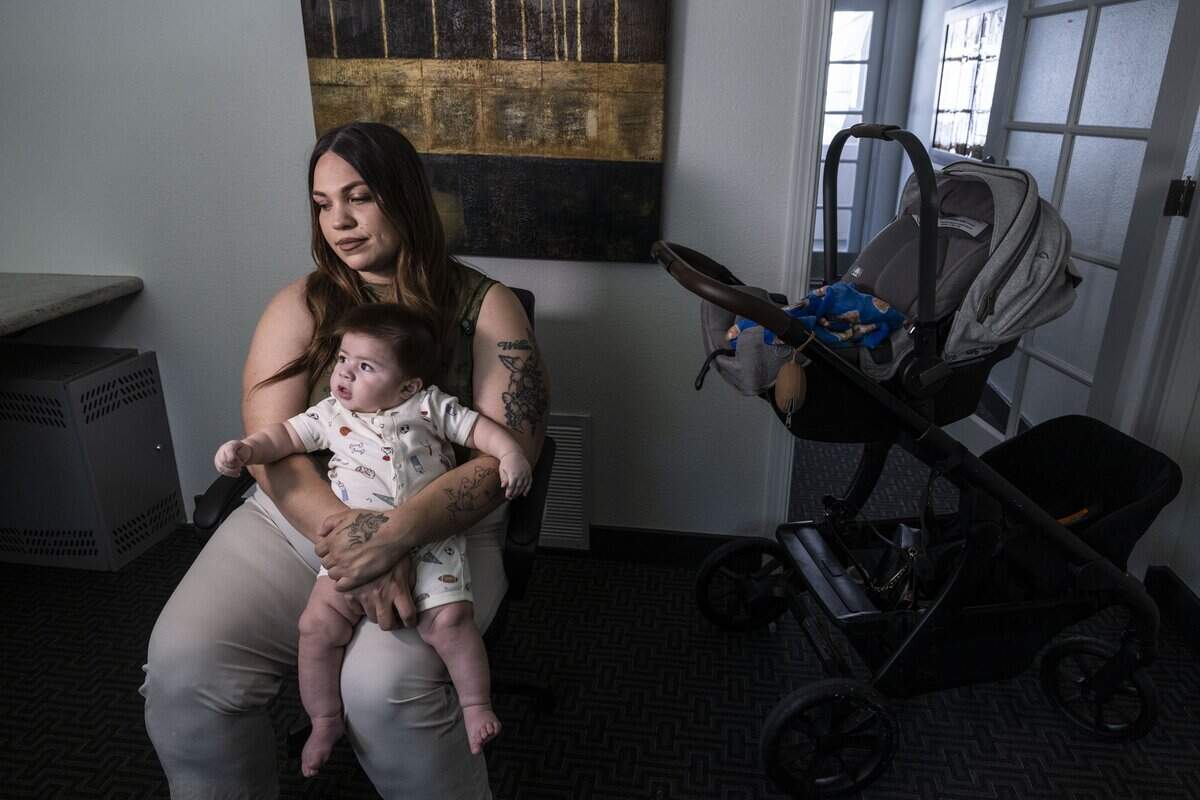 Maria Melendez, the wife of Esparto fireworks explosion victim Joel Melendez Jr., talks her husband on Wednesday, June 17, 2026, at her apartment complex in Walnut Creek, as she holds her son Jeremiah Melendez, who was born after his father’s death.