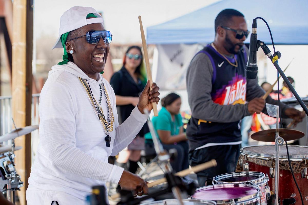 Q Lynn Smoke, left, and Brian Jackson Jr., right, play the drums with Ambitious Rhythm during the Mardi Gras celebration on Sunday, Feb. 19, 2023, in Old Sacramento.