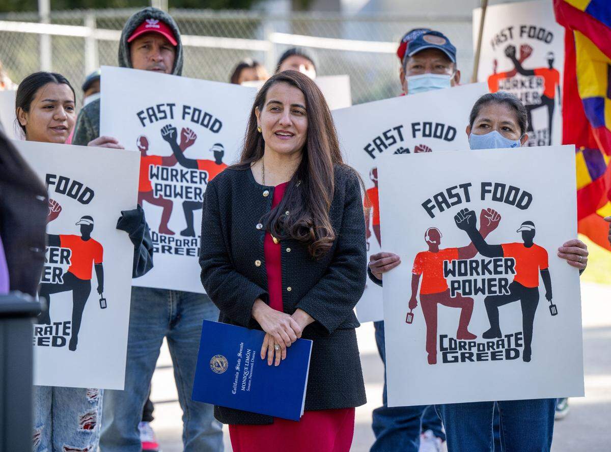 State Sen. Monique Limón, D-Santa Barbara, listens to a speaker on Feb. 14 at a rally at the Capitol for her bill, SB 476, that would require employers pay workers for the cost of getting a food handler’s card.
