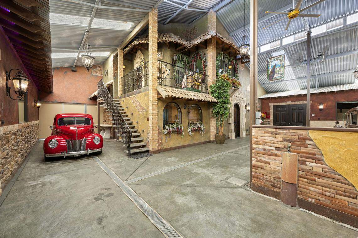 The 2,600-square-foot collector’s garage features custom cabinetry, a car lift and showroom-quality finishes for the ultimate auto enthusiast.