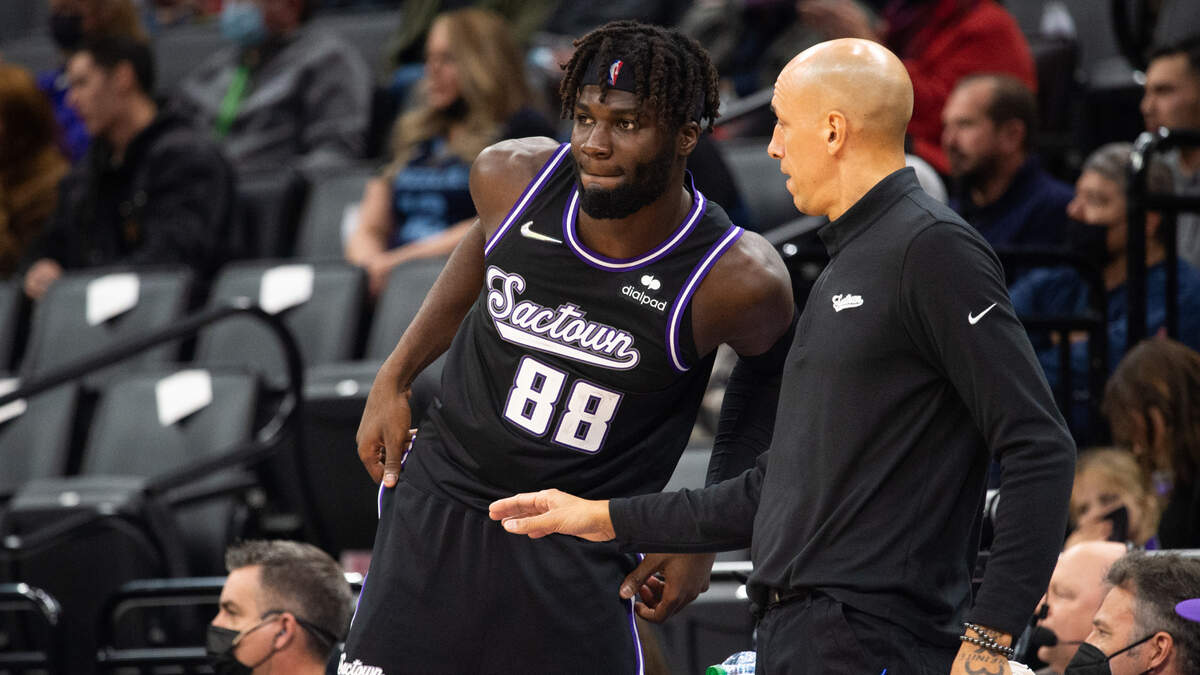 Sacramento Kings acting head coach Doug Christie talks to Sacramento Kings center Neemias Queta (88) as he enters the game in the second half during a game at the Golden 1 Center on Friday, Dec 17, 2021, in Sacramento.