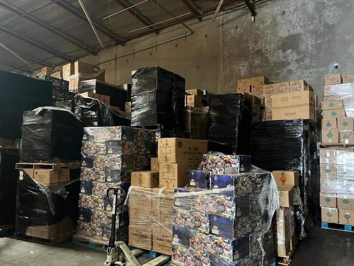 Fireworks seized by state and federal authorities during a May 21, 2025 in Commerce, California. The brown boxes in the center of the photograph are “Quick Draw” fireworks, which contain more than 500 grams of explosive material and are illegal in California, according to fireworks experts who spoke with The Bee.