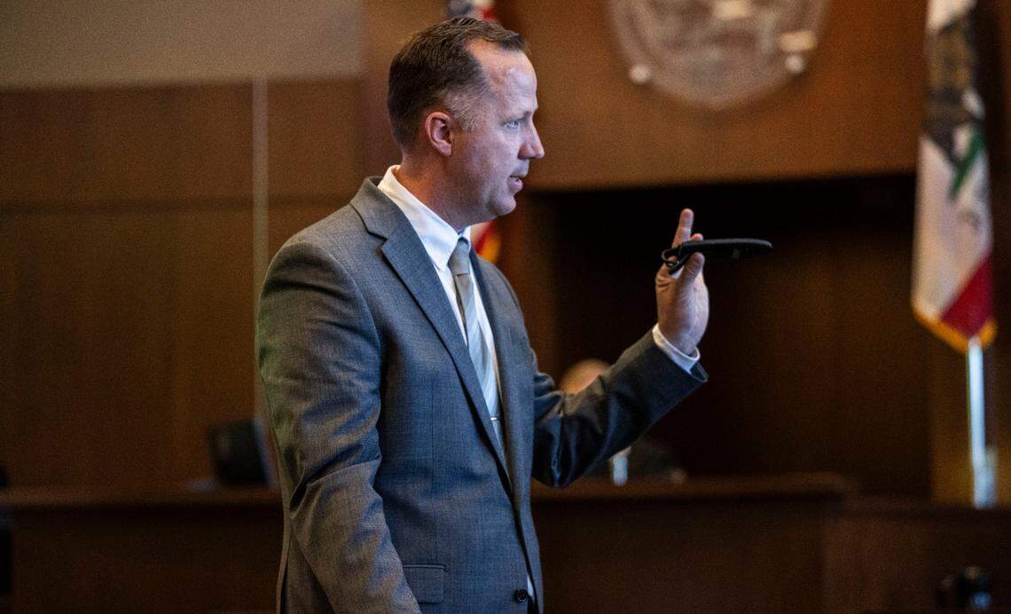 Yolo County prosecutor Frits Van de Hoek holds knife Monday similar to the one he alleges that former UC Davis student Carlos Reales Dominguez used during a series of stabbings in 2023. It was the first day of the trial for Dominguez, who is accused of murder and attempted murder.