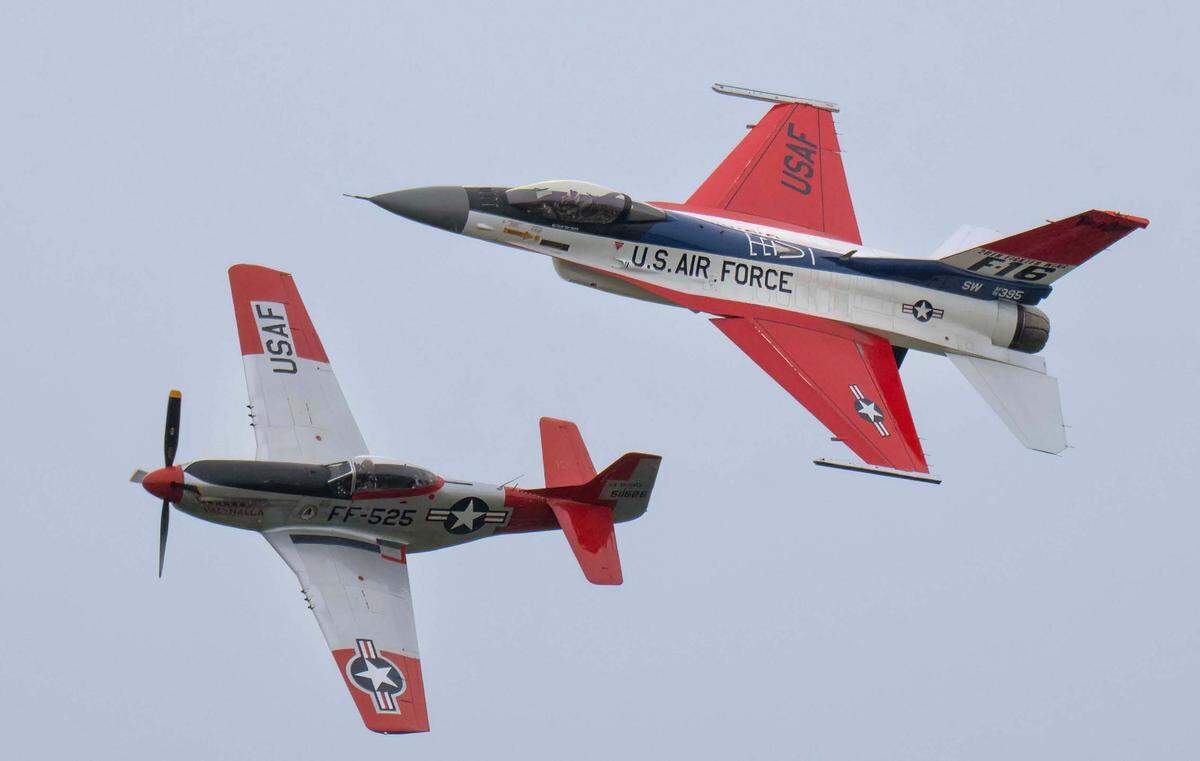 A P-51 Mustang and the F-16 Viper demonstration aircraft fly side-by-side in an Air Force heritage flight at the California Capital Airshow at Mather Airport on Saturday.