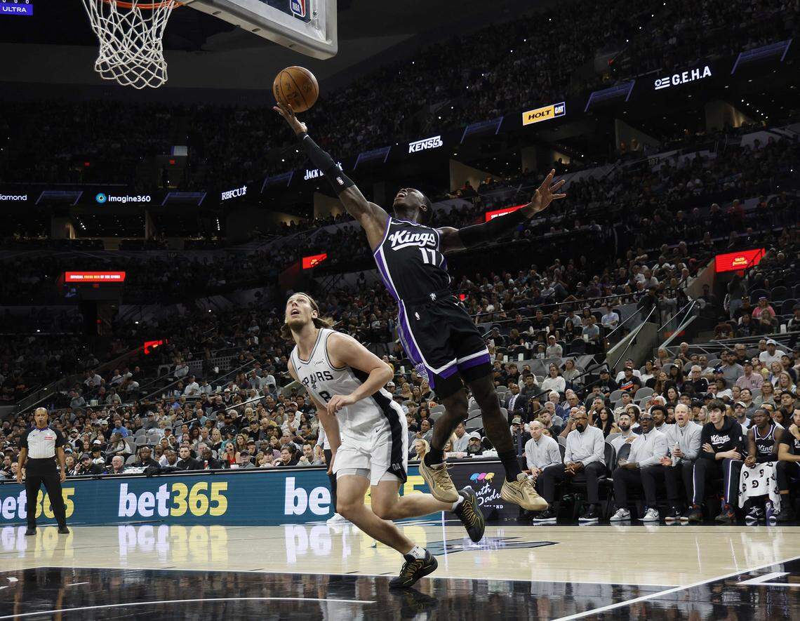 Dennis Schroder of the Sacramento Kings scores in the first half in Sunday's loss to the Spurs in San Antonio. The team is 3-11 after their second game of a five-game road trip.