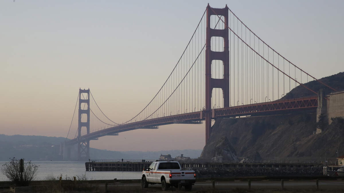 Smoke from wildfires is seen behind the Golden Gate Bridge Monday, Oct. 28, 2019, in Sausalito, Calif. A wildfire that has been burning in Northern California’s wine country since last week grew overnight as nearly 200,000 people remain under evacuation orders. The California Department of Forestry and Fire Protection said Monday that the fire in Sonoma County north of San Francisco now spans 103 square miles (267 square kilometers). That’s up from 85 square miles (220 square kilometers) on Sunday. (AP Photo/Eric Risberg)