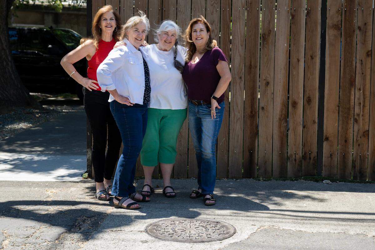 From left, sisters Katy Styles-Rogers, Cindy Moore, Glory Styles and Sally Styles-Zanotti stand next to Berry’s Foundry manhole cover earlier this month in Sacramento. The foundry was started by their great-grandfather.