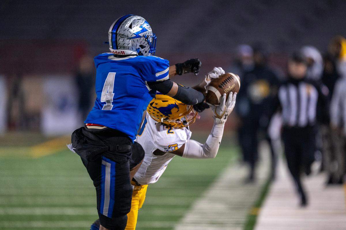 Grant Pacers wide receiver Koby Shabazz (2) catches a pass in front of Rocklin Thunder cornerback Josiah Andrews (4) in the second half of the Sac-Joaquin Section Division II championship on Friday.