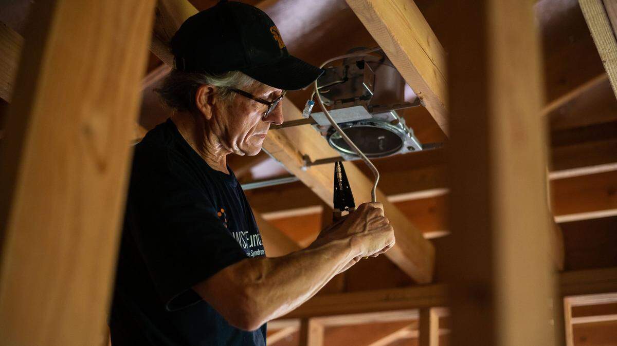 Jeff Harris, who represented District 3 on the Sacramento City Council, works on wiring inside the future restroom of his accessory dwelling above his garage Friday, Sept. 18, 2021, in River Park. The city has added more ADUs in recent years.