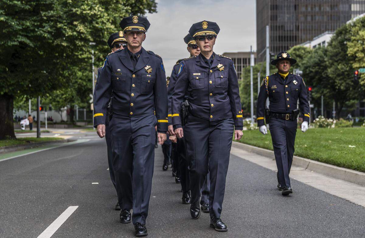 Retiring Sacramento Police Chief Kathy Lester, right, marches with her interim replacement Zachary Bales to the annual California Peace Officers’ Memorial enrollment ceremony in Sacramento on Monday. Lester will retire on May 15. 