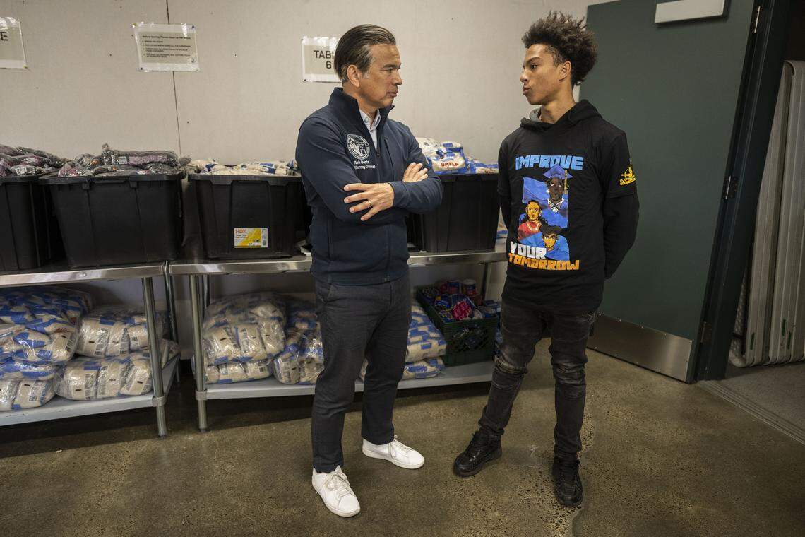 California Attorney General Rob Bonta speaks with Brandon Marshall, a Natomas High School student, as he highlights the importance of service programs like AmeriCorps and Improve Your Tomorrow on Tuesday. Improve Your Tomorrow is an AmeriCorps supported program that helps young men of color go to college.