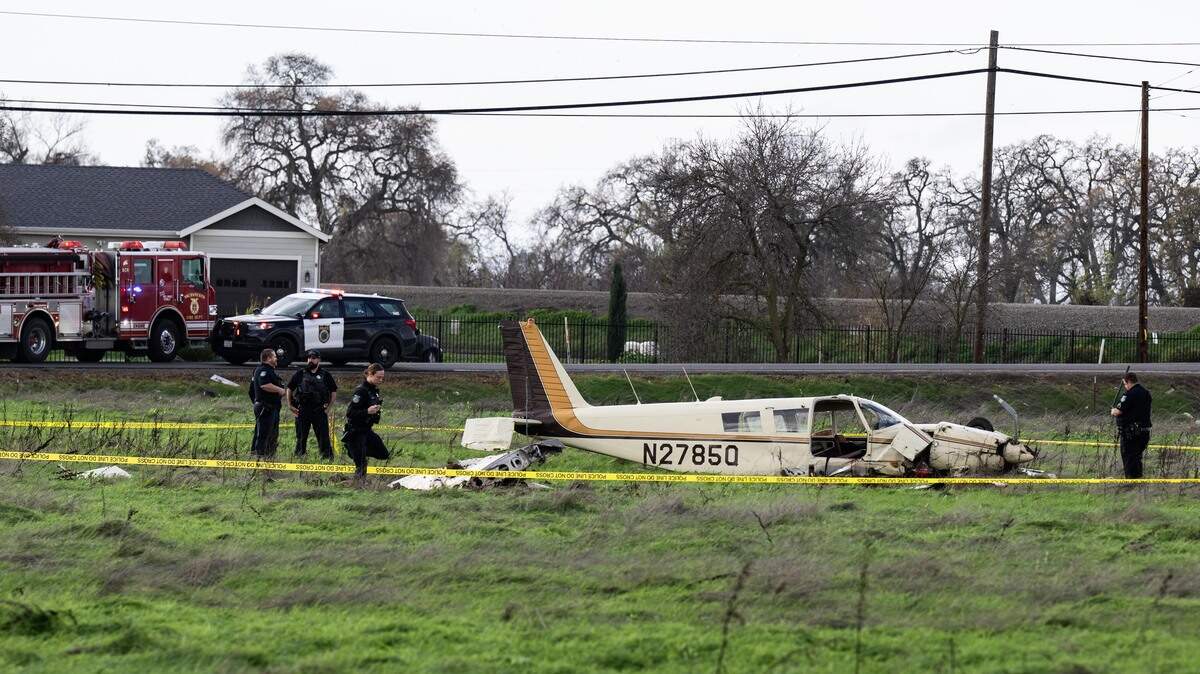 Sacramento police investigate a small plane after it crashed in an open field near Rio Linda Boulevard and Claire Avenue on Wednesday.