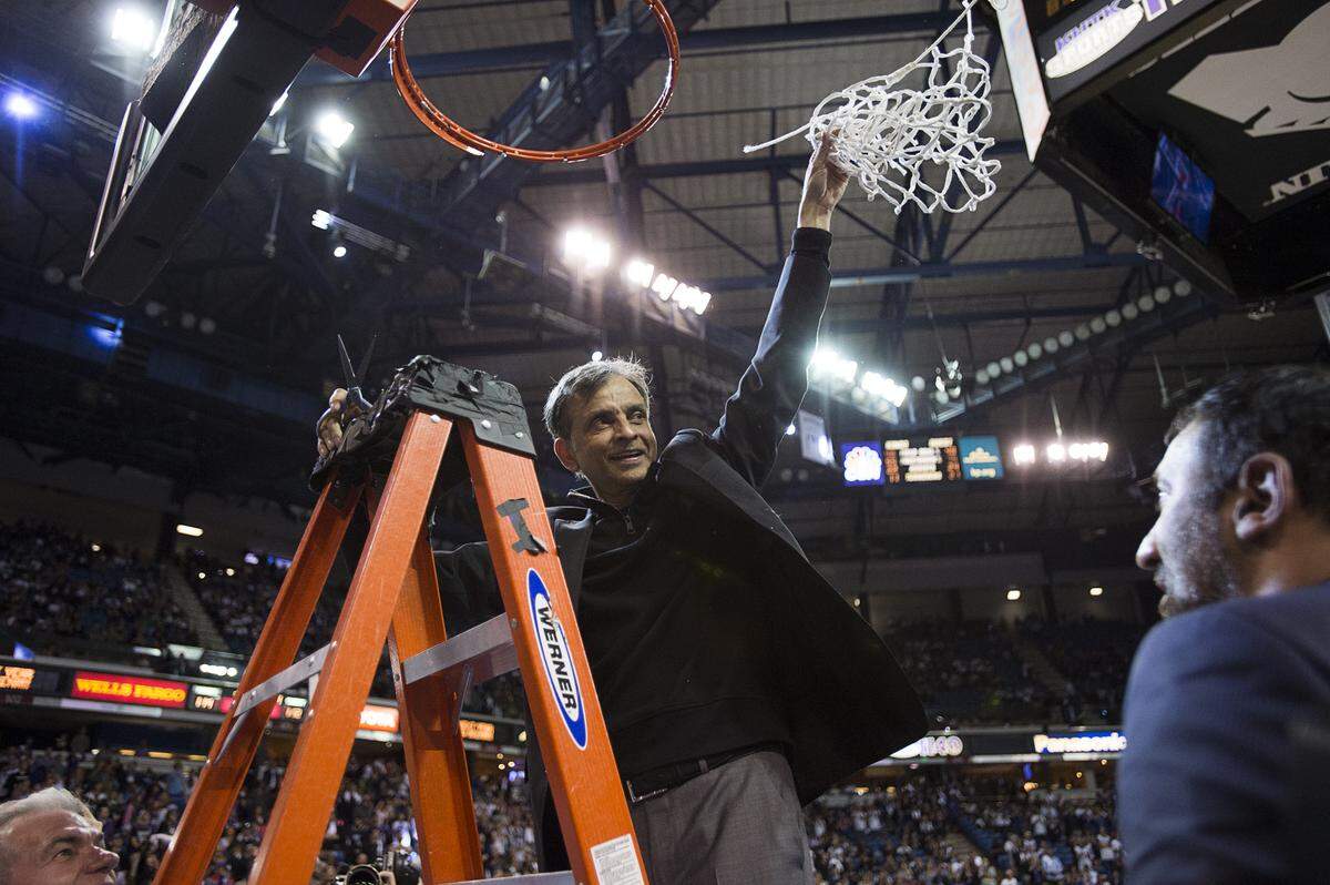 Sacramento Kings owner Vivek Ranadivé cuts down the net after the last game at Sleep Train Arena on April 9, 2016.