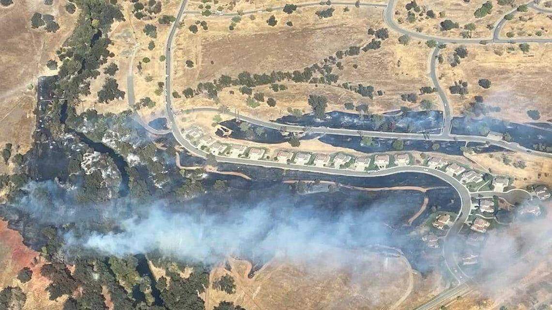 Firefighters on Tuesday Oct. 12, 2021, battled a vegetation fire that had burned more than 40 acres near housing at Beale Air Force Base in Yuba County, California.