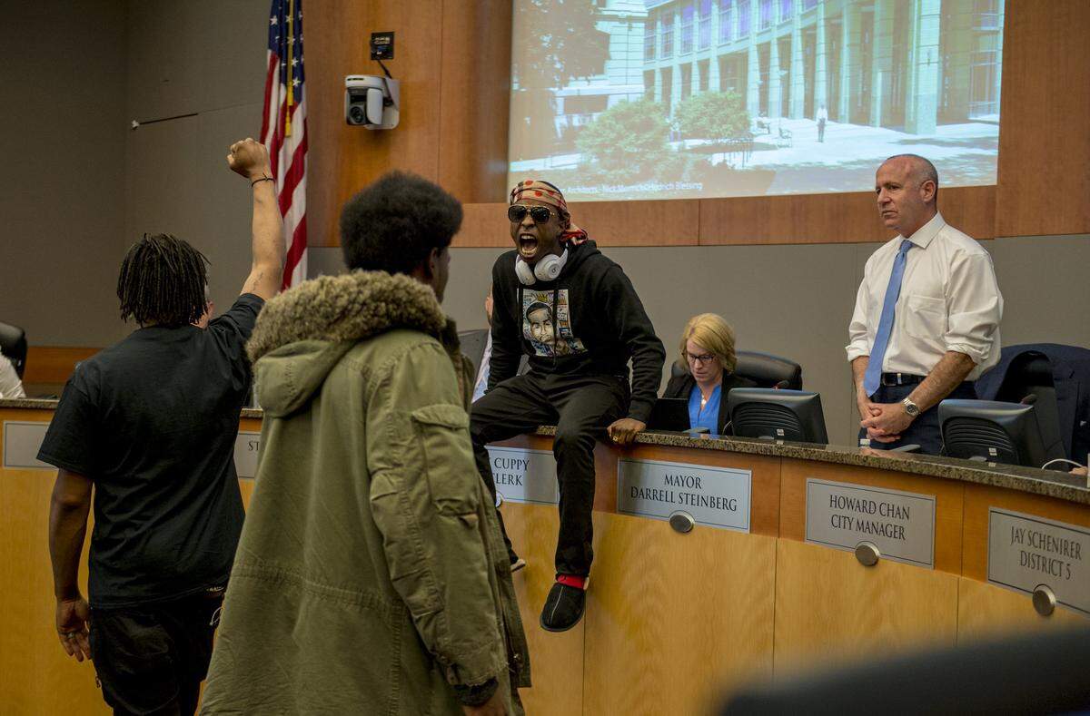Stevante Clark, brother of Stephon Clark, stormed the Sacramento City Council, jumping on the desk in front of Mayor Darrell Steinberg, briefly forcing the council to leave the chambers on Tuesday afternoon, March 27, 2018