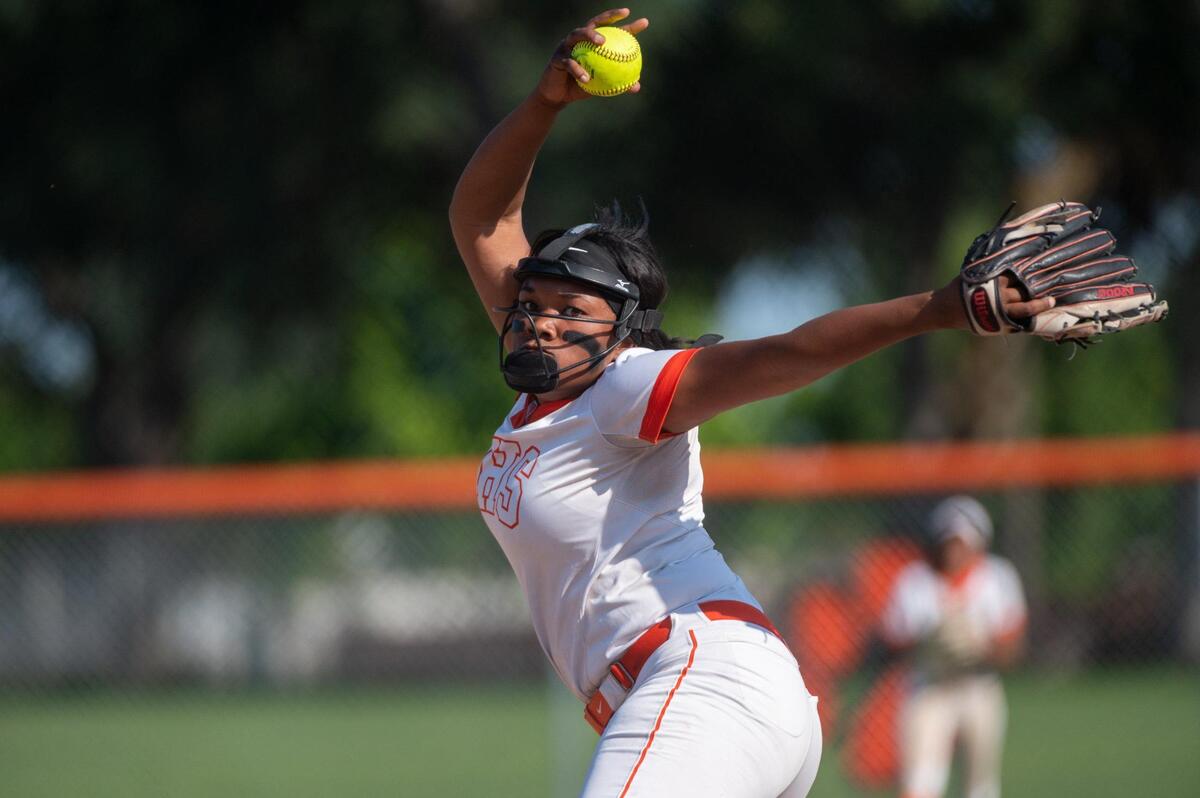 Roseville High School Tigers’ Malaya Johnson pitches against Woodcreek High School on Monday at Roseville High School.