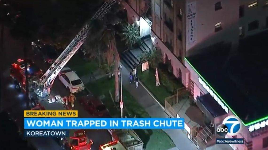 Los Angeles firefighters rescue a woman stuck 20 feet down a building’s trash chute in Los Angeles, officials said.