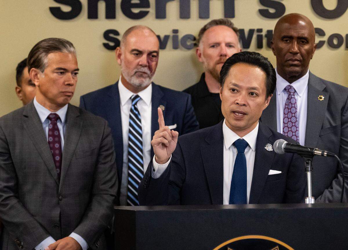 Sacramento County District Attorney Thien Ho, joined by state Attorney General Rob Bonta, left, Placer DA Morgan Gire and Sacramento Sheriff Jim Cooper, speaks about local and state efforts to combat the fentanyl epidemic during a press conference on Thursday.