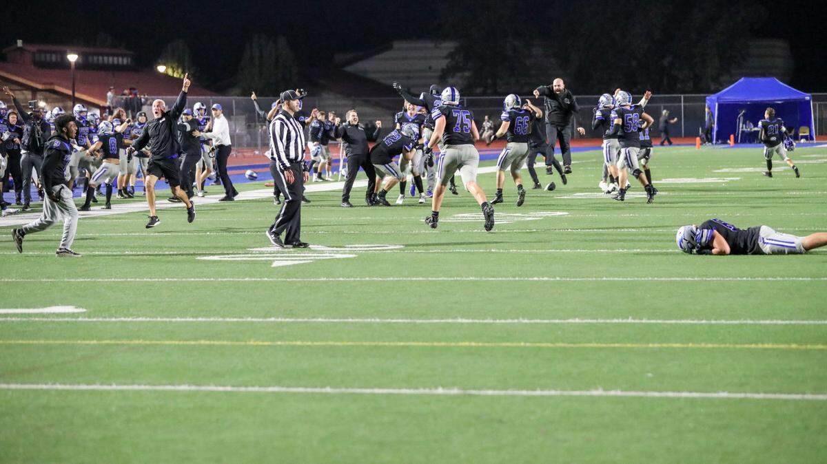 Rocklin football players and coaches celebrate a dramatic 51-48 comeback victory over St. Mary’s on Friday, Nov. 19, 2021.