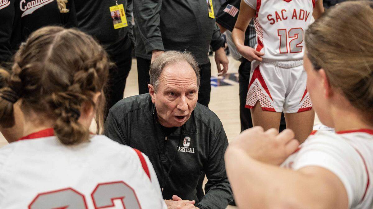 Sacramento Adventist Capitals coach Scott Tedmon speaks to his players during timeout against the Forest Lake Christian Falcons in the CIF Sac-Joaquin Section Division VI girls basketball championship on Feb. 27. Tedmon, a Sacramento Superior Court judge, retired from coaching in 2021, returned in 2025 to coach the Sac Adventist girls basketball team before being fired from the position this week.

