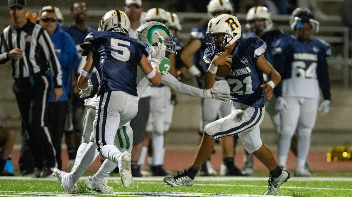 Rosemont Wolverines running back Michael Cherry (21) picks up a screen block from teammate Alex Rodriguez (5) on his way to his third touchdown in the first half against the Dixon Rams in the first-round CIF Sac-Joaquin Section Division V football playoff game on Friday, Nov. 3, 2023, at Rosemont High School.