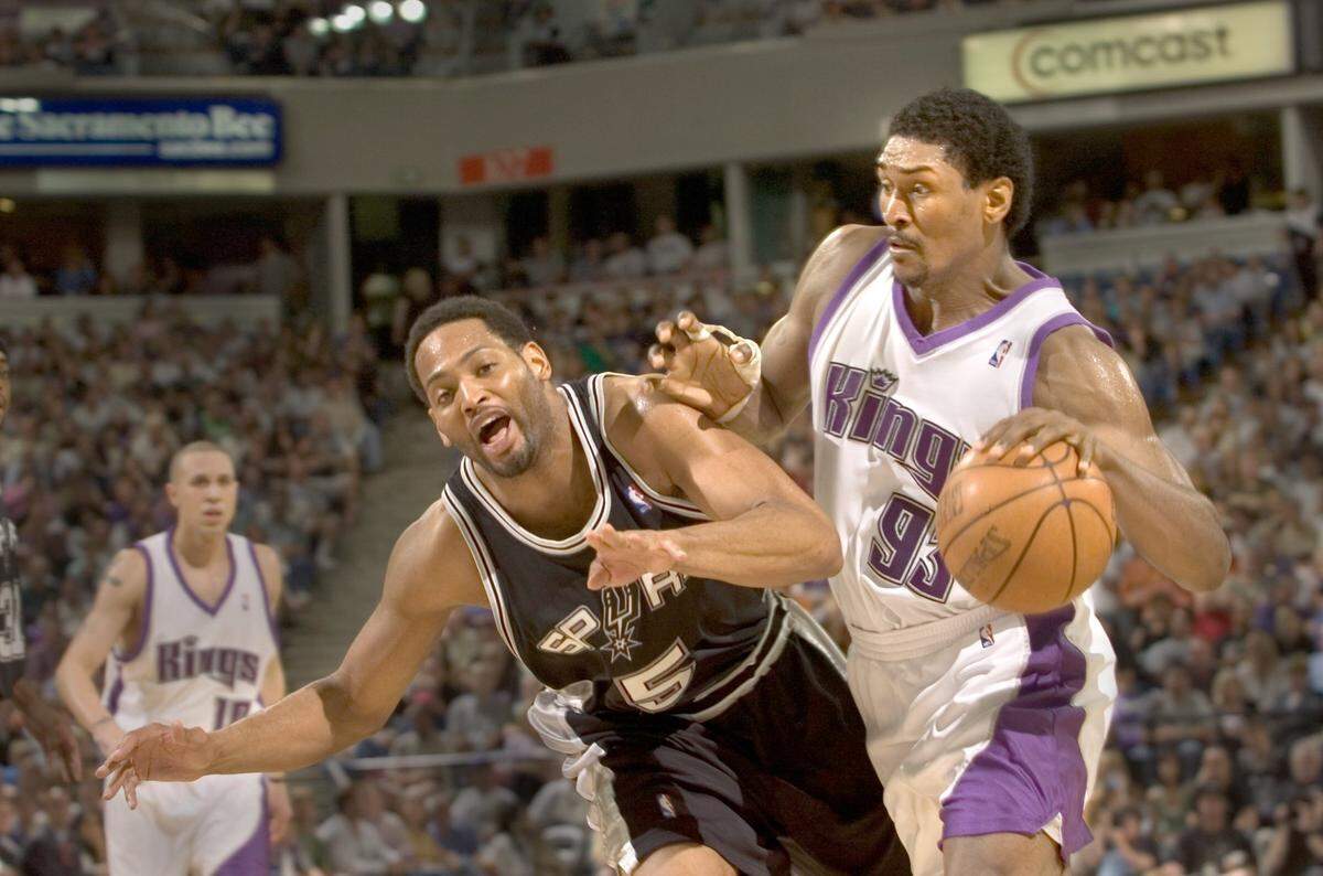 Ron Artest is fouled by Robert Horry during the fourth quarter of Game 6 of the first round of Western Conference playoff series between the Sacramento Kings and San Antonio Spurs at Arco Arena on Friday, May 5, 2006.