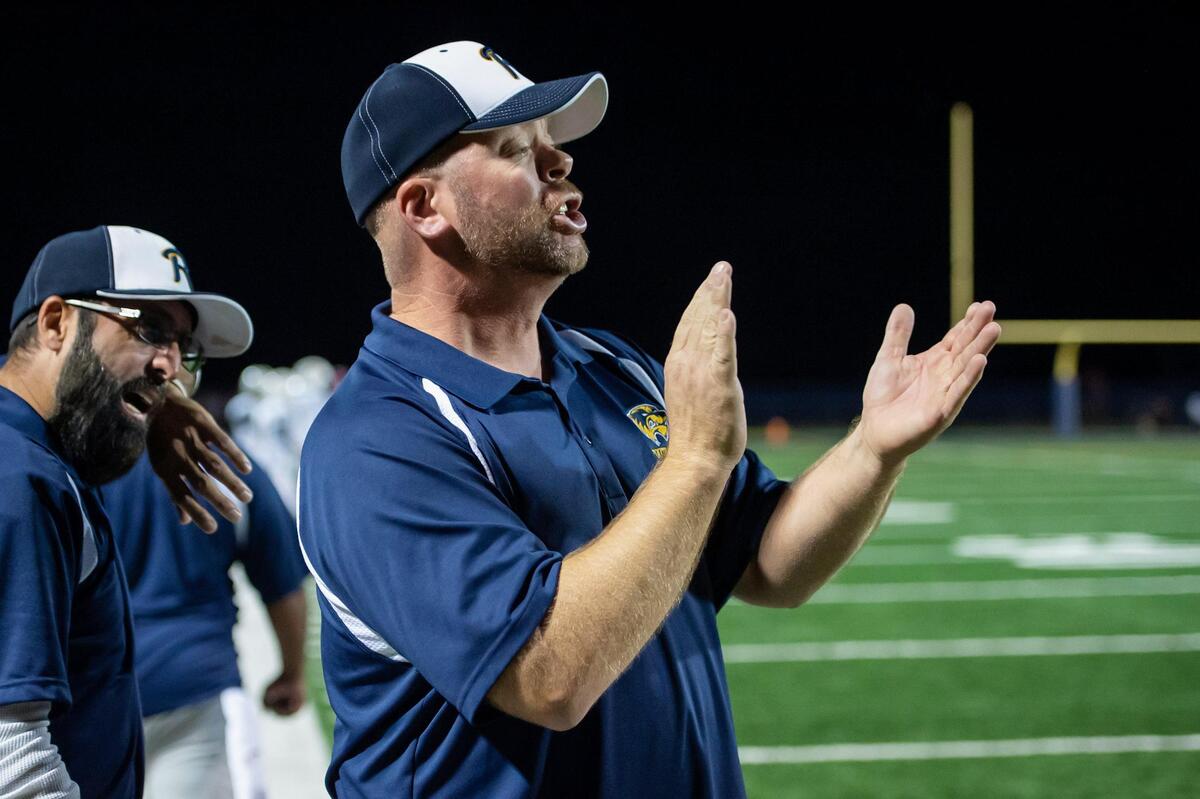 Rosemont head coach John Straw cheers on his team after they scored a touchdown during the fourth quarter in the game Friday at Union Mine High School.
